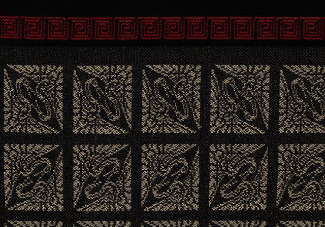 A black background with a pattern of squares and a red border