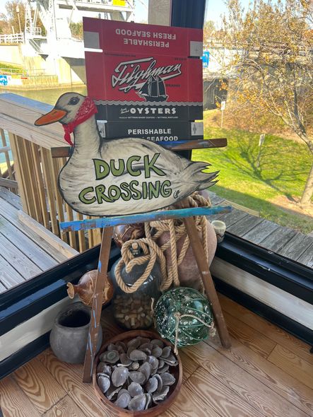 Gina's at the bridge duck crossing sign
