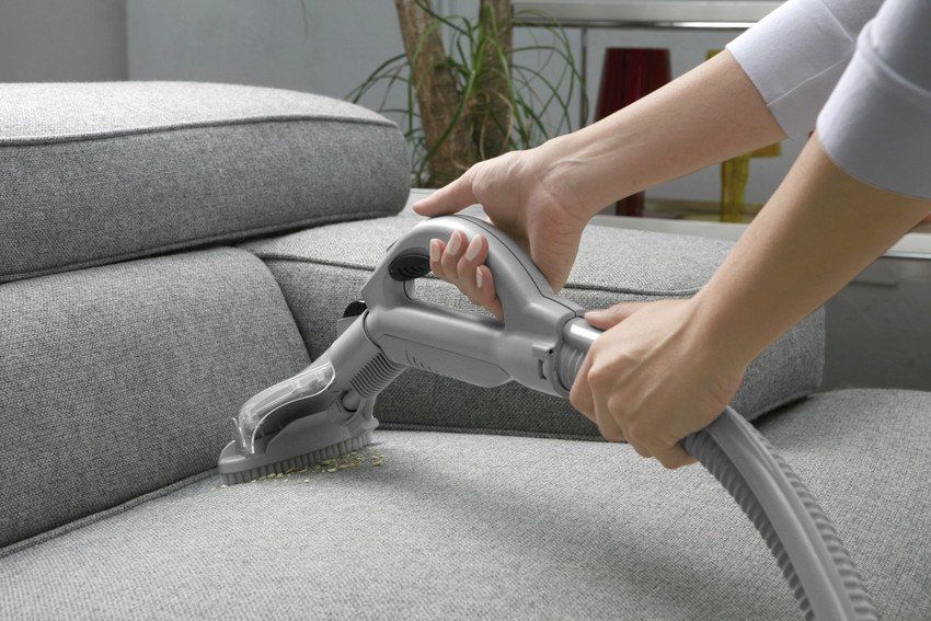 Hoover cleaning sofa
