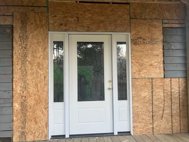 Professional contractor installing windows, doors and frames.