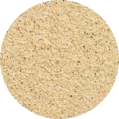 A close up of a circle of sand on a white background
