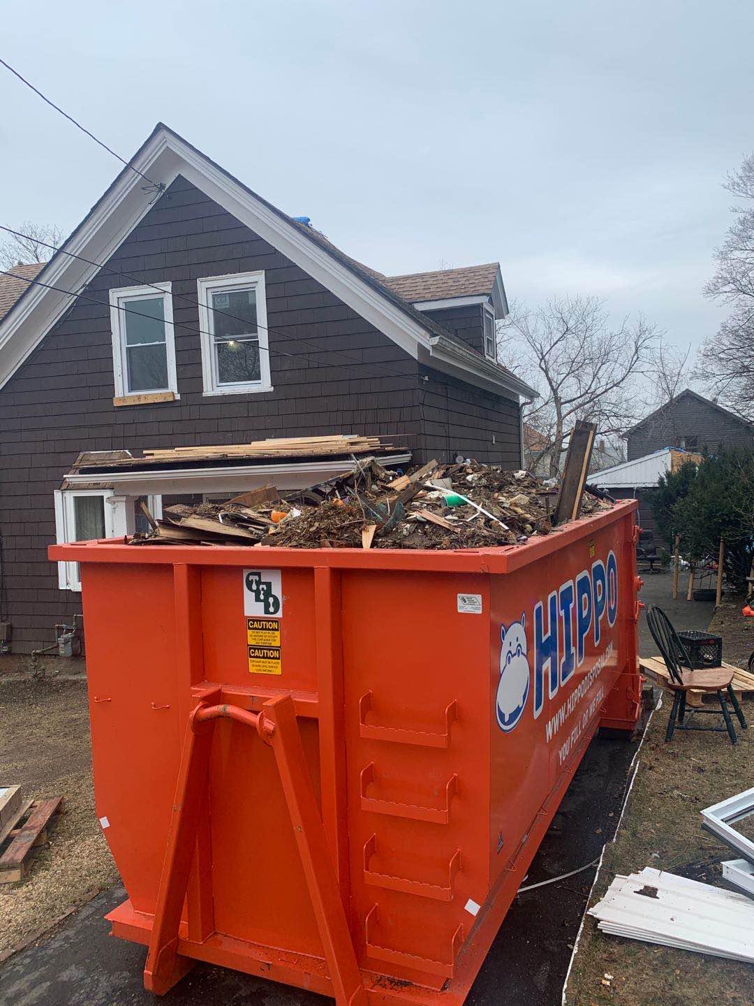 Dumpster Rental full of wooden debris