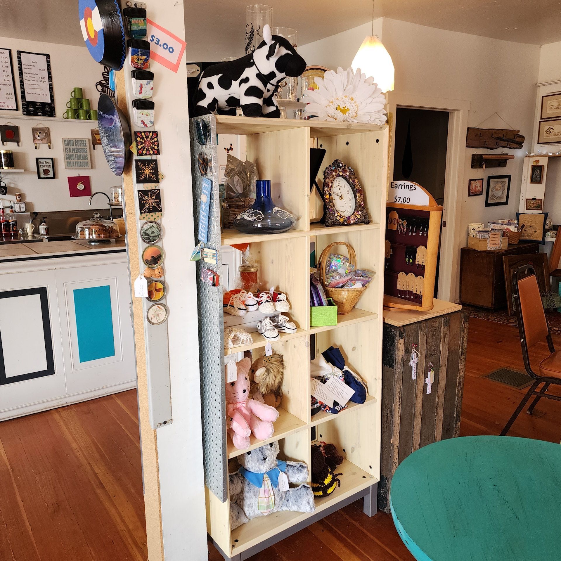 A shelf in a room with a cow on it