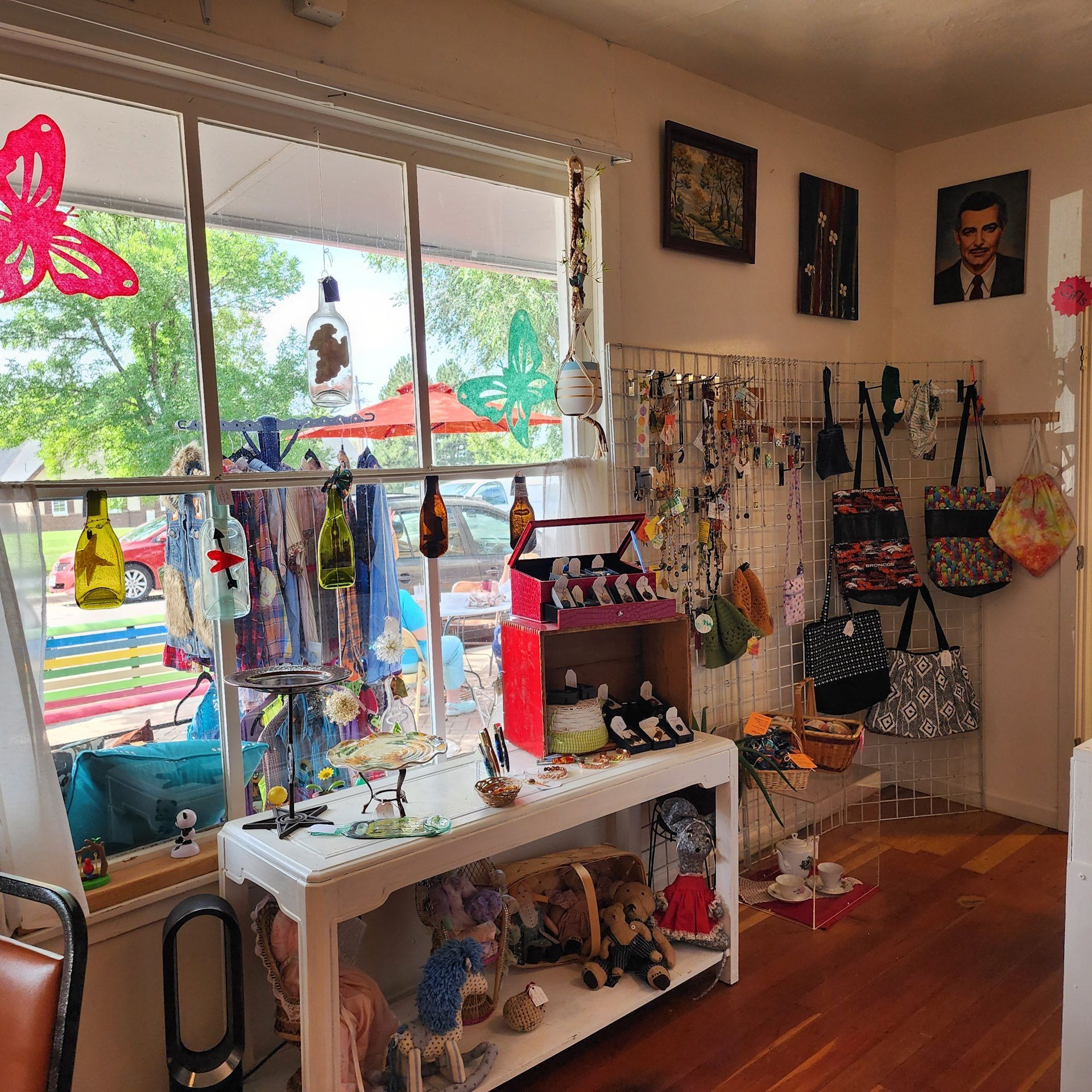 A room with a table and a window with a butterfly on it