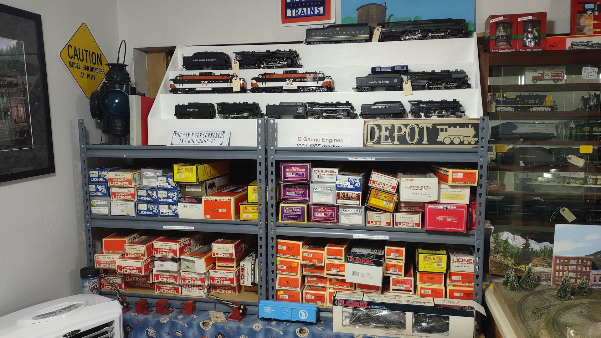 A room filled with lots of toy trains including one that says detroit