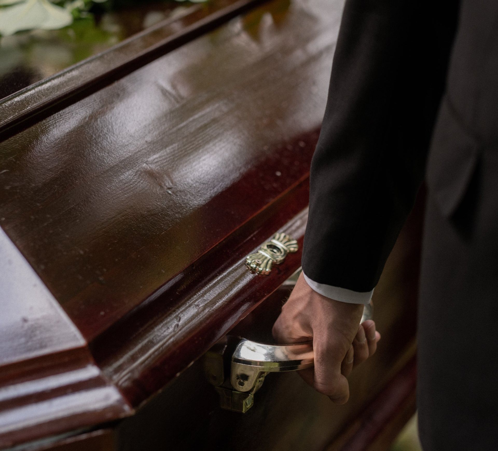 Casket being lifted