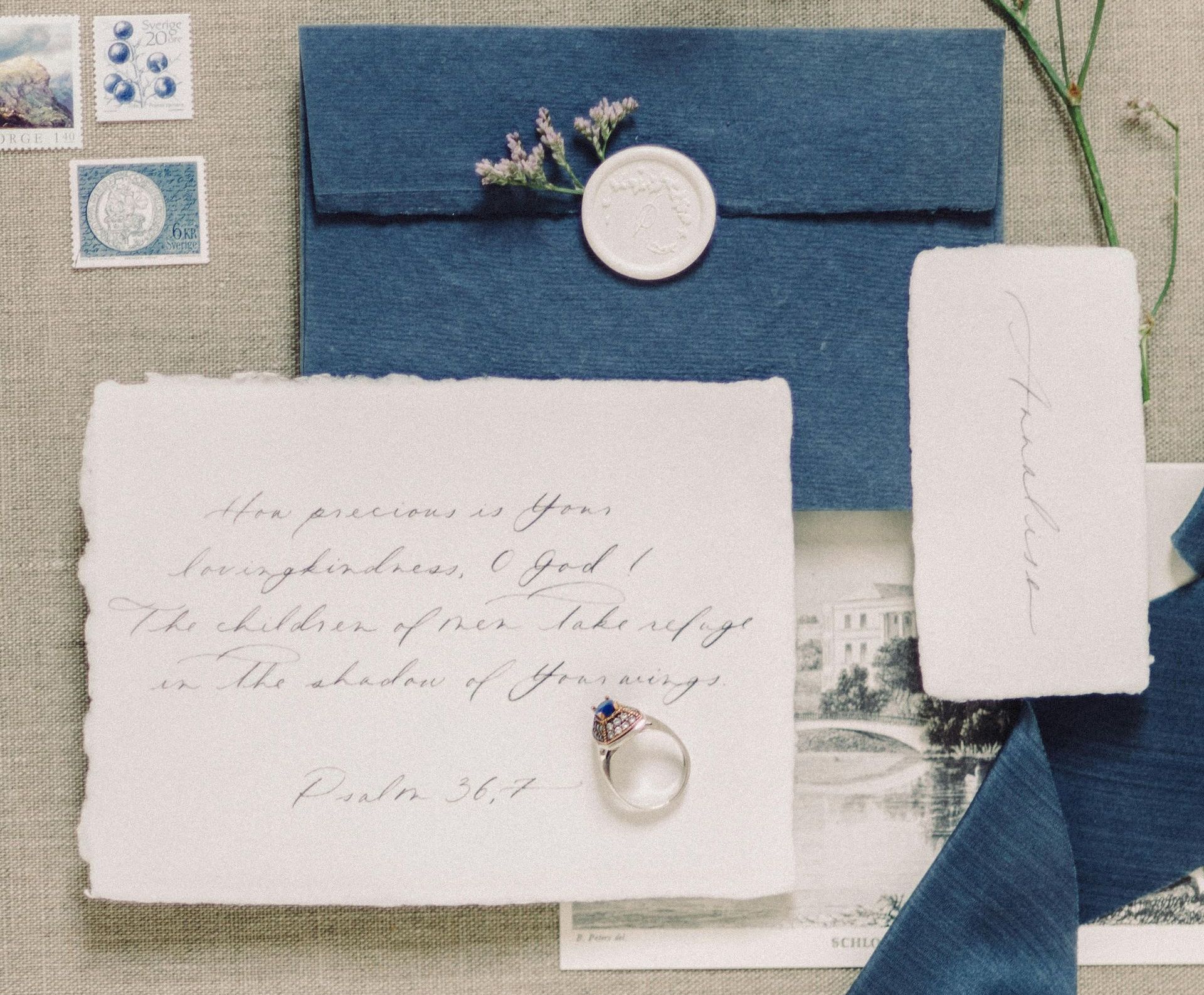 A letter next to a blue ribbon and remembrance items