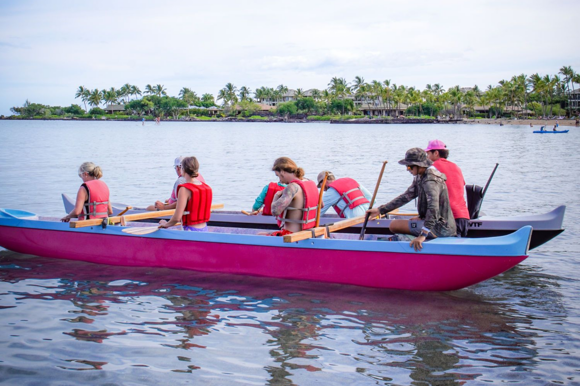 A woman is riding a wave on a surfboard in the ocean.