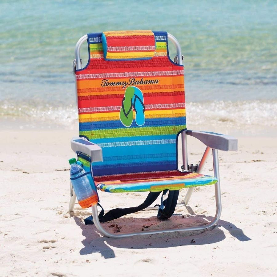 A sunny bahamas beach chair sits on the beach