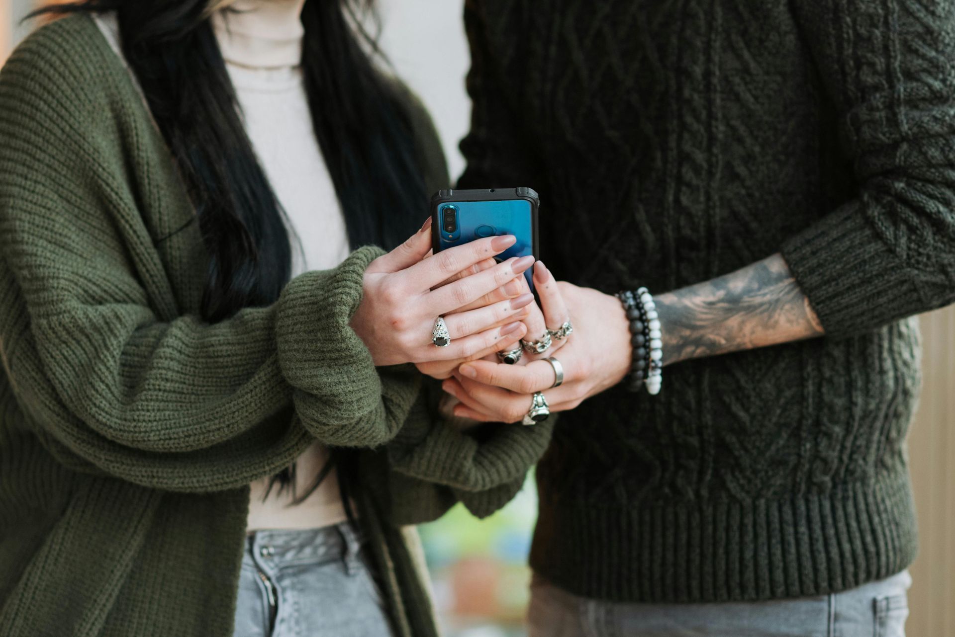 Man and Woman holding phone