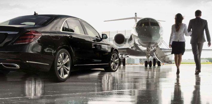 Couple boarding private jet