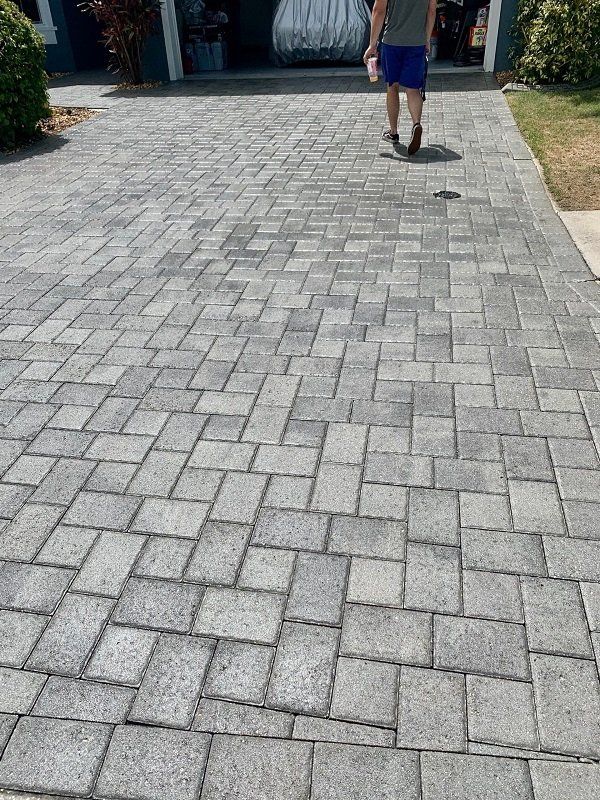 Paver sealing driveway in Boca Raton – before and after.