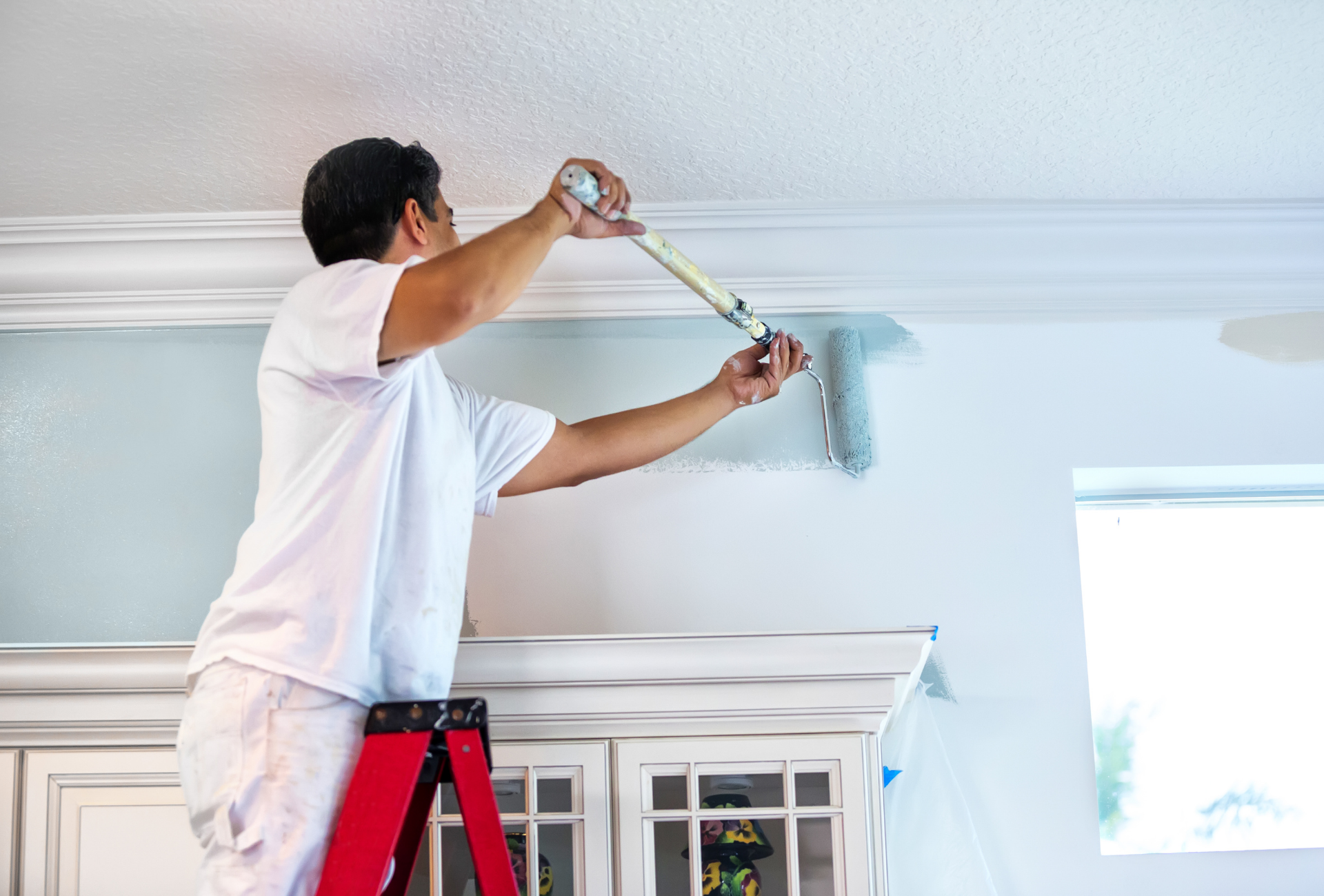 A bathroom with a walk in shower and a view of a garden