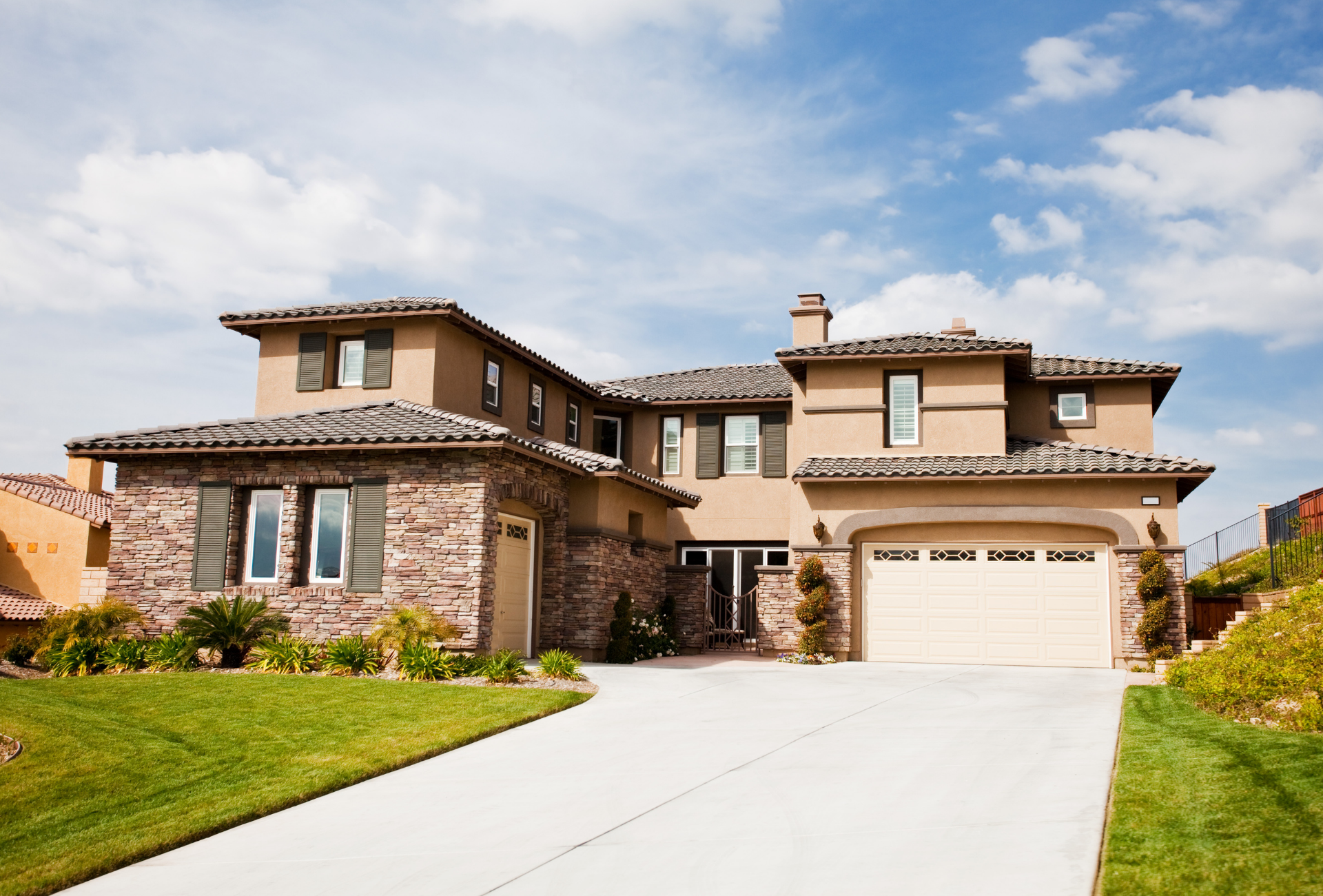 A living room with a stone fireplace and a flat screen tv