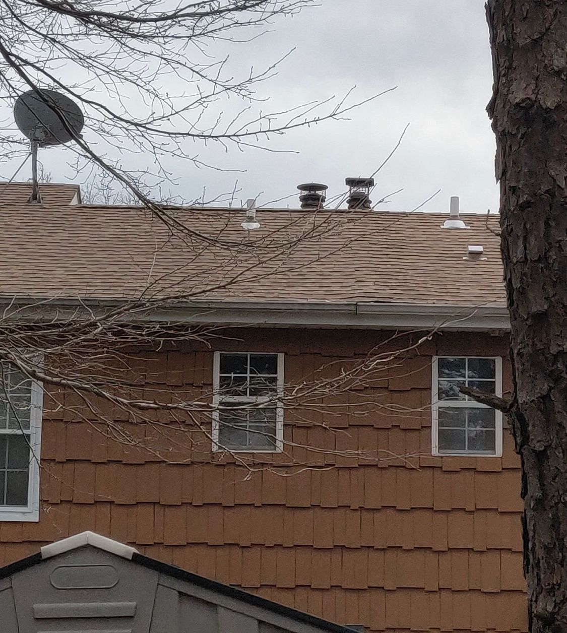 A house with a satellite dish on the roof