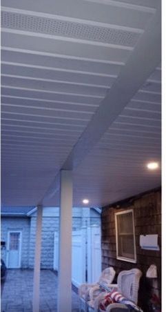 A picture of a porch with a white ceiling.