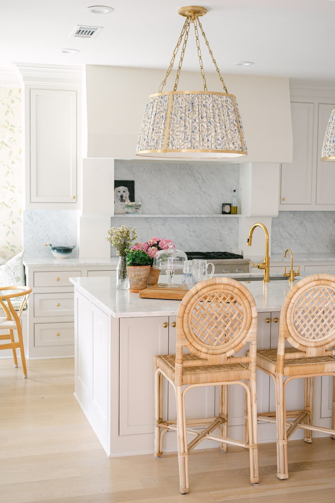A luxury kitchen in Fort Worth with white cabinets and a large island