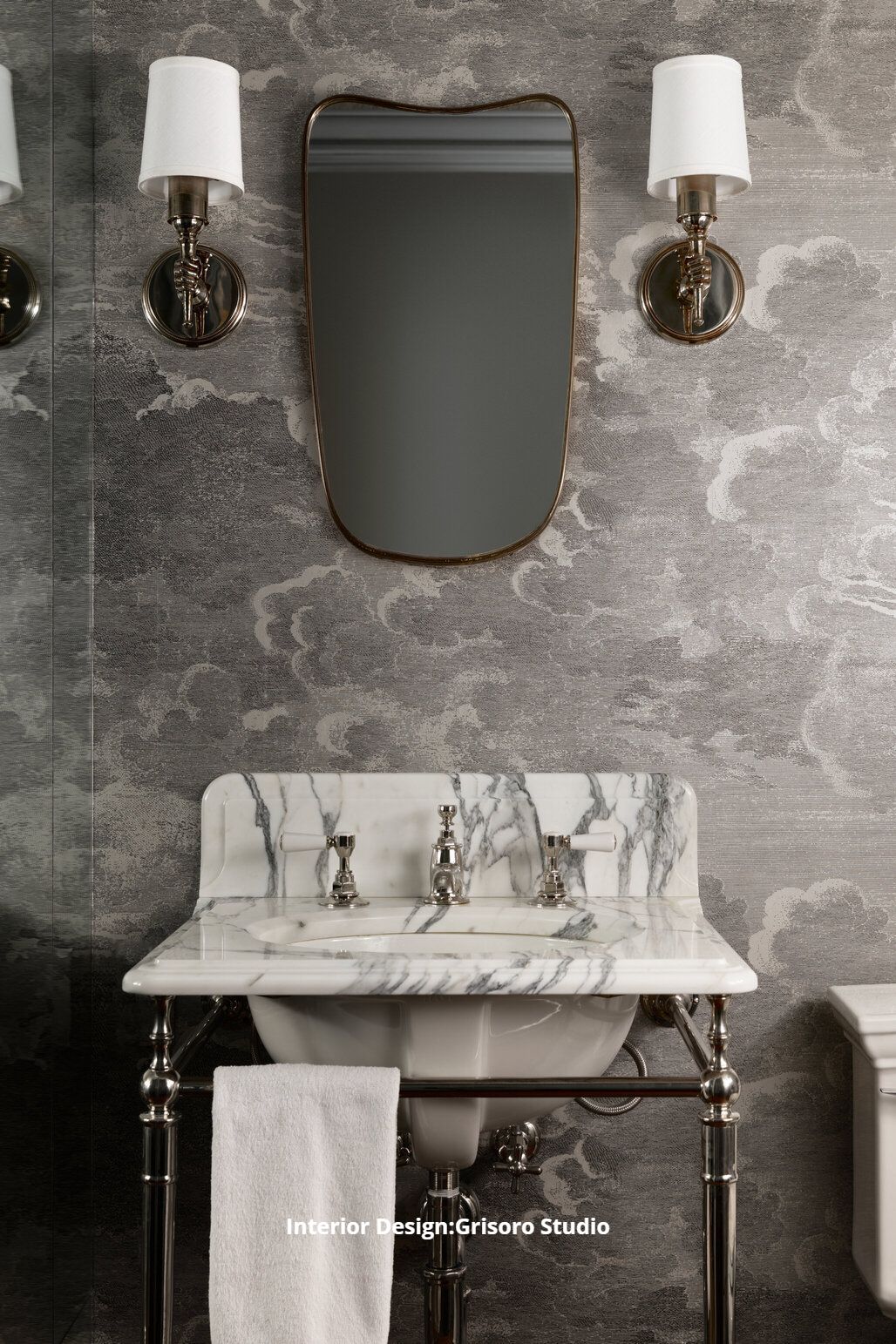 A custom bathroom with a quartz sink and a mirror on the wall.