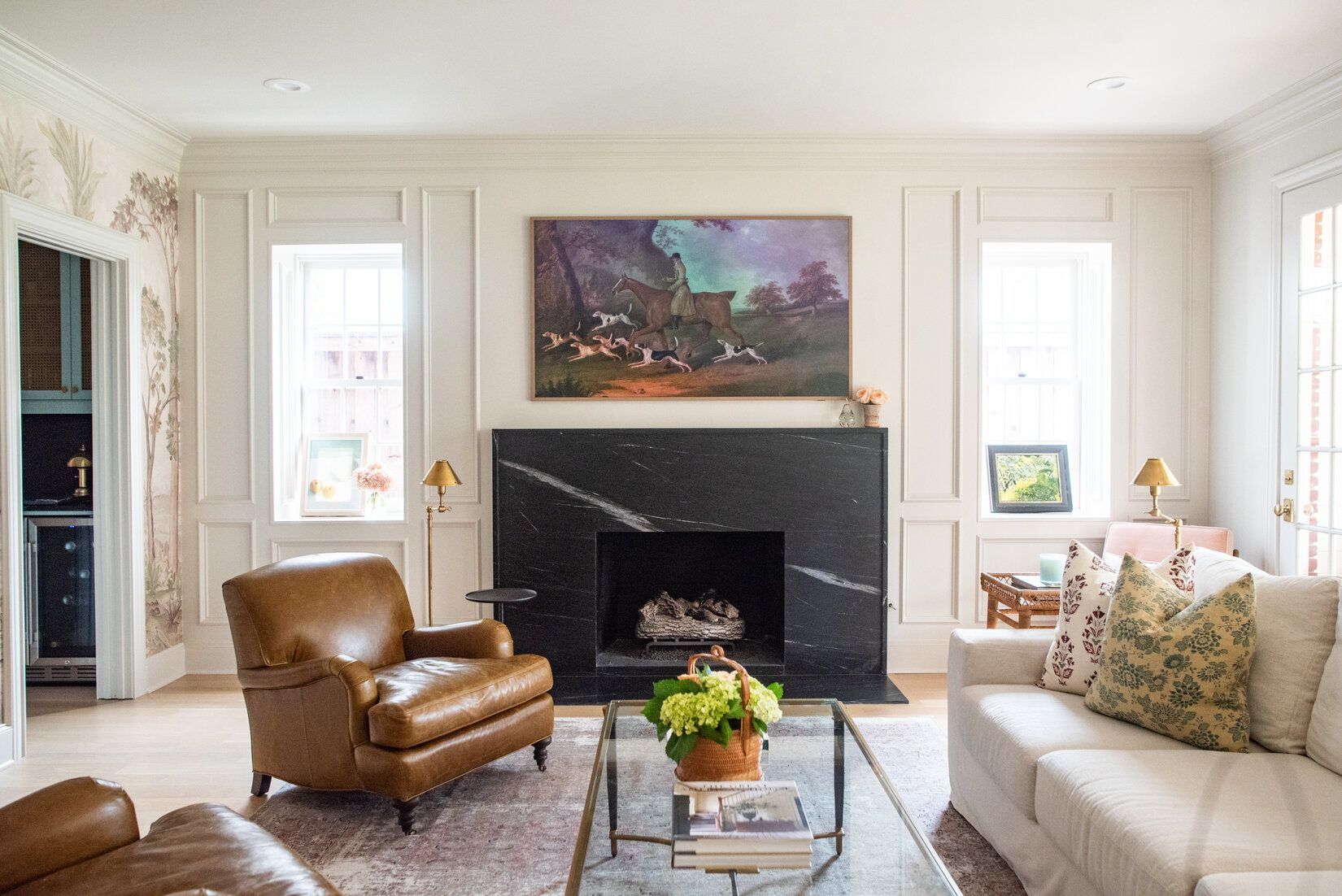 A high end living room in Fort Worth with custom molding and a marble fireplace