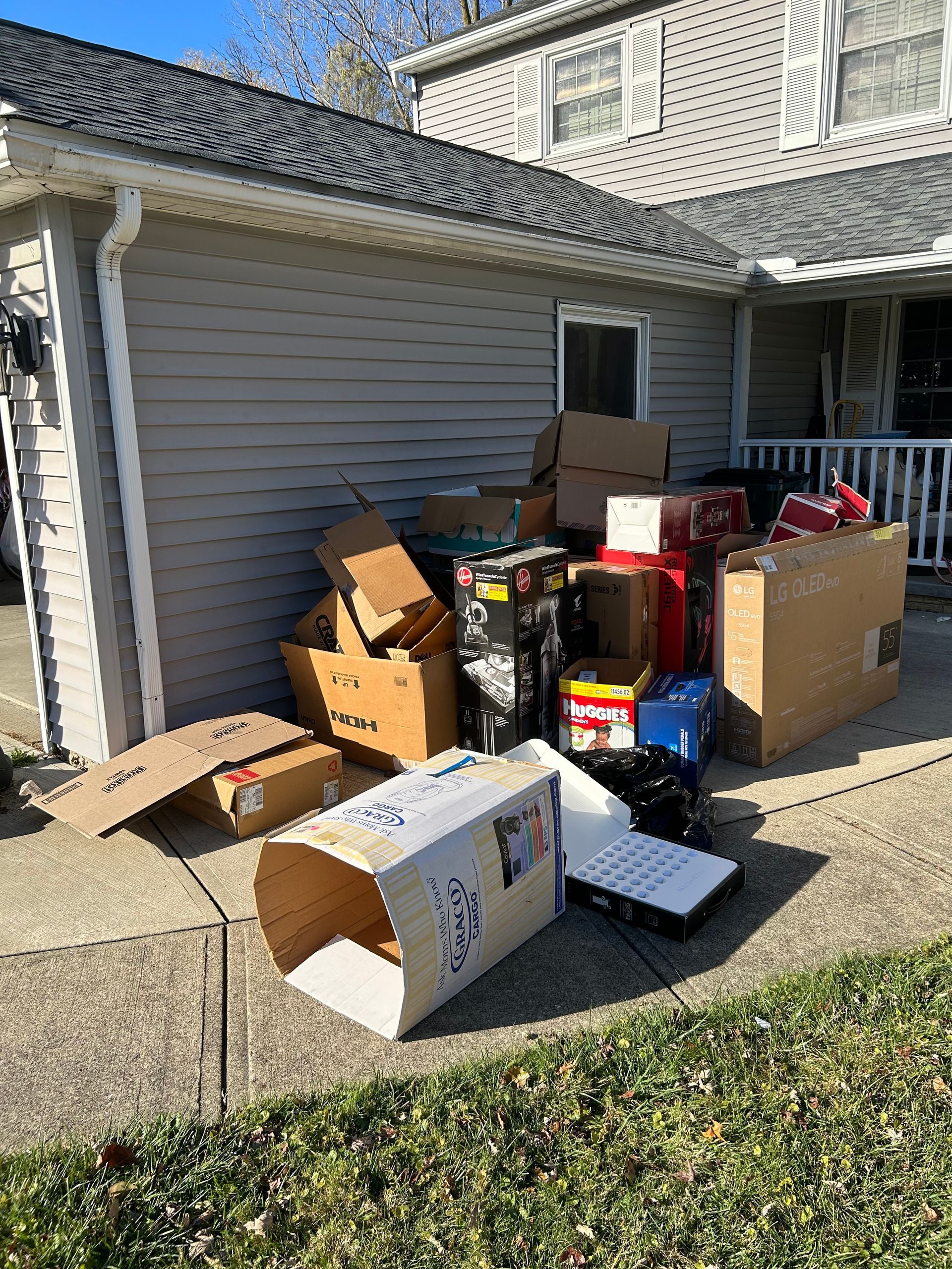 Pile of cardboard for recycling and old junk piled up for disposal in Westlake