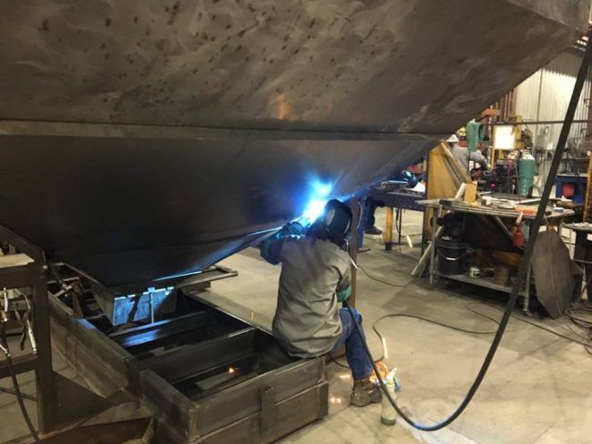 Welding up the seam of a fertilizer tender.