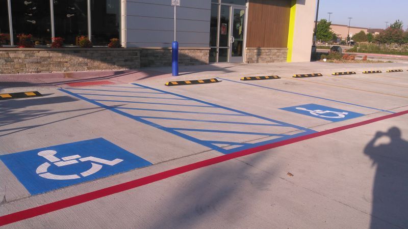 A handicapped parking spot in front of a building
