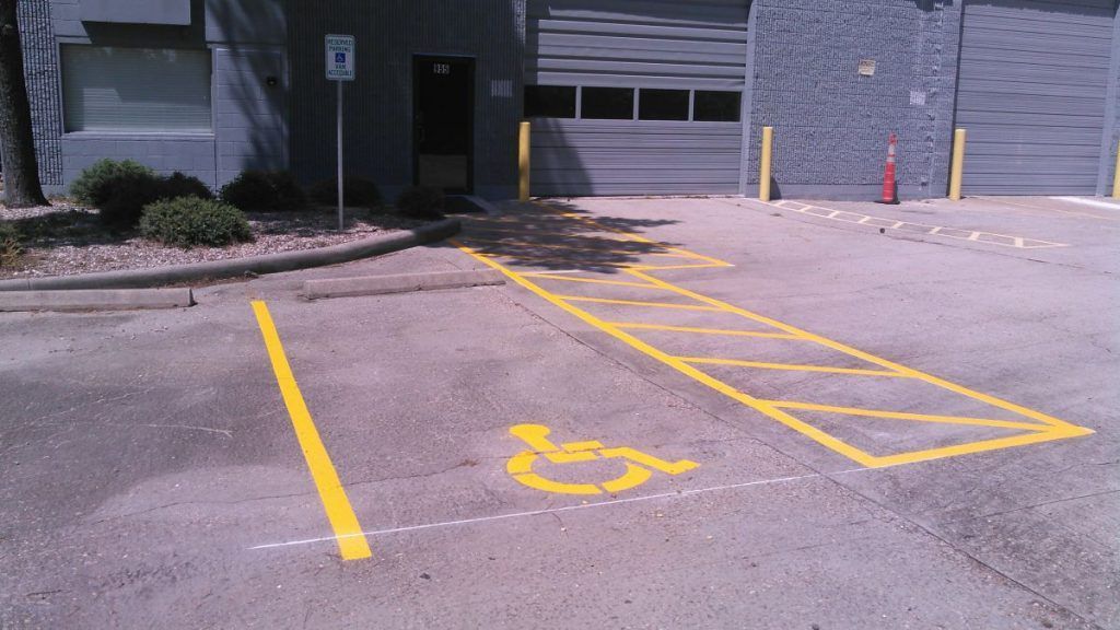 A handicapped parking spot in a parking lot