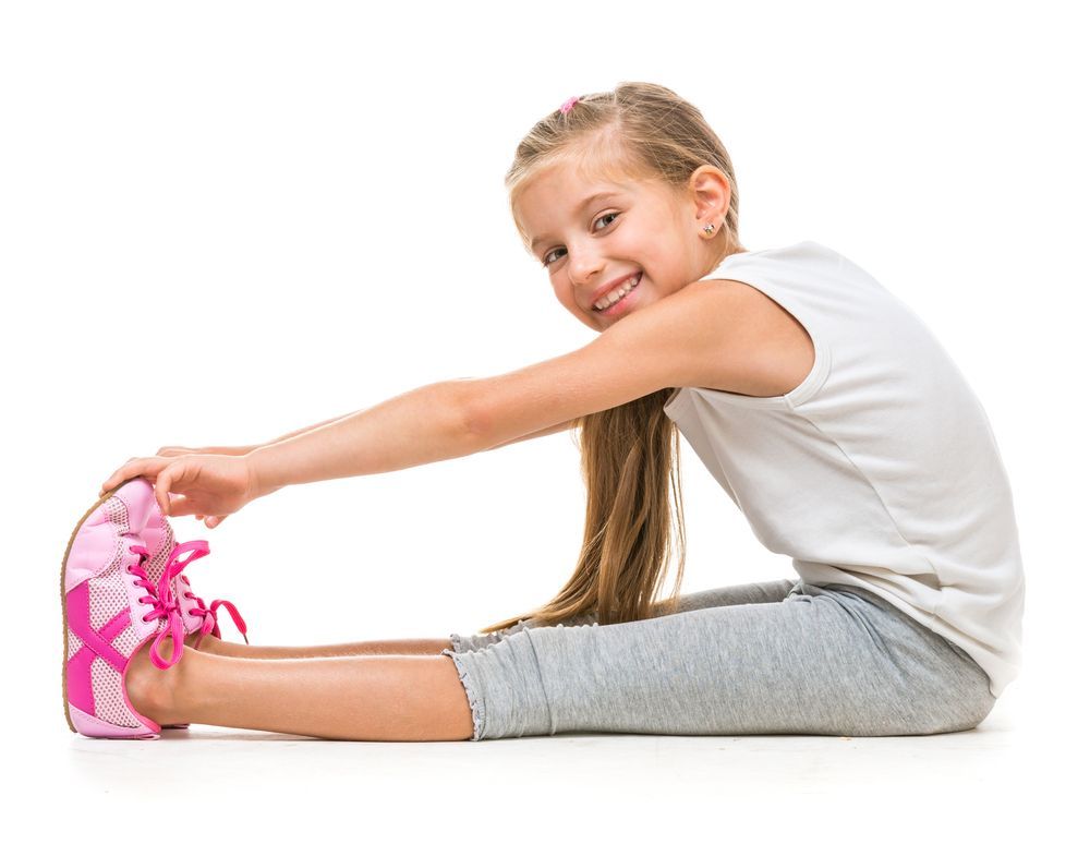 smiling girl touching her toes