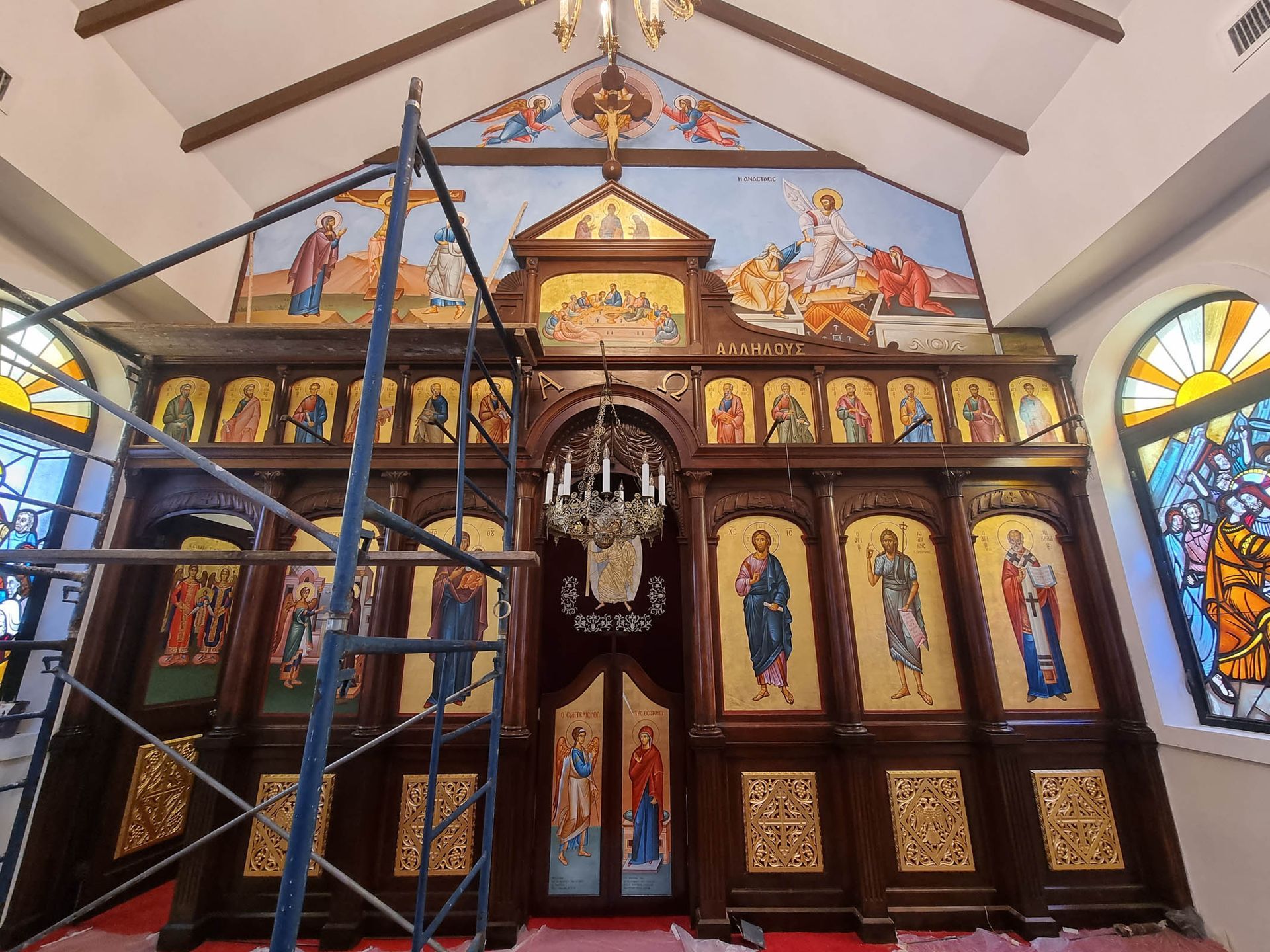 Installing hand-painted Orthodox, Eastern Rite Christian iconography. Iconostasis Altar screen at Annunciation Church Bahamas