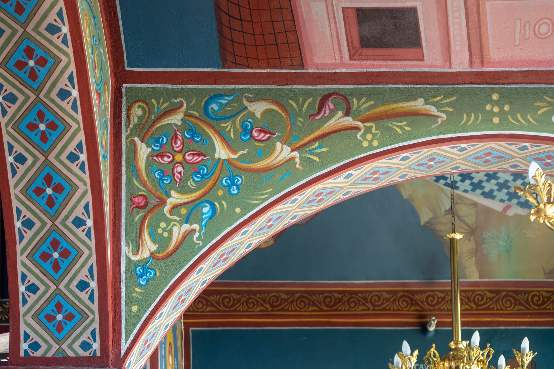 Byzantine ornamental arch detail with vine motifs and geometric diamond pattern by Byzantine Artworks in an Orthodox church