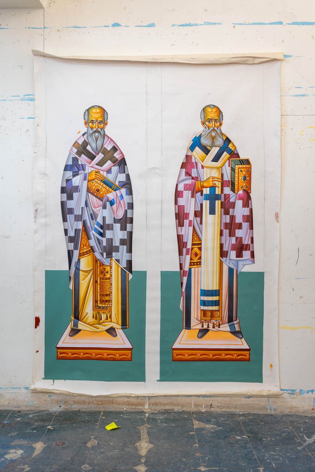 Hand-painted Eastern Christian Russian iconography of  Saints Basil and Nicholas full-body hierachs on canvas in studio 