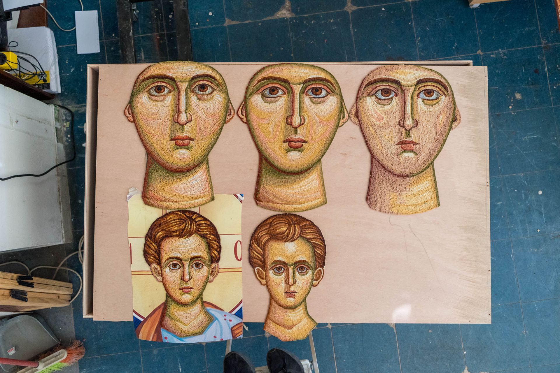 Comparitive study of Byzantine mosaic face styles showing stylistic differences in handmade portraits for church art projects