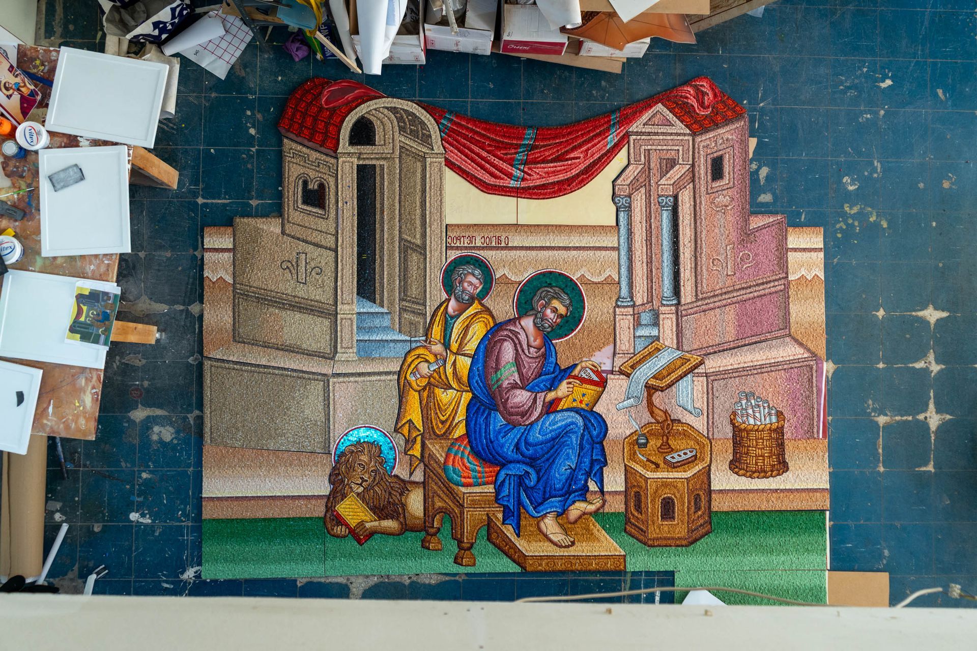 Progress photo Byzantine church mosaic panel in reverse-setting process, large St. Mark figure for pendentive installation.
