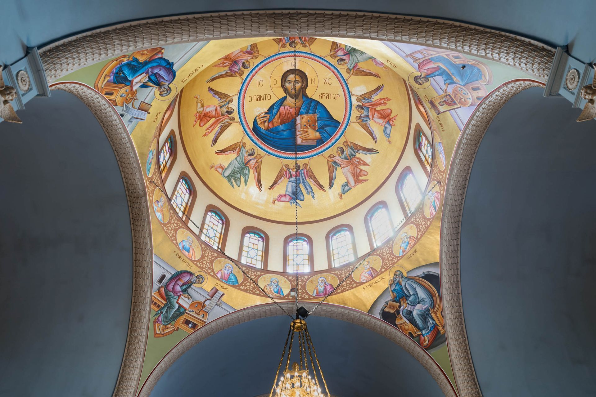 Byzantine Pantokrator dome iconography with prophets and evangelists in pendentives Orthodox church ceiling mural restoration