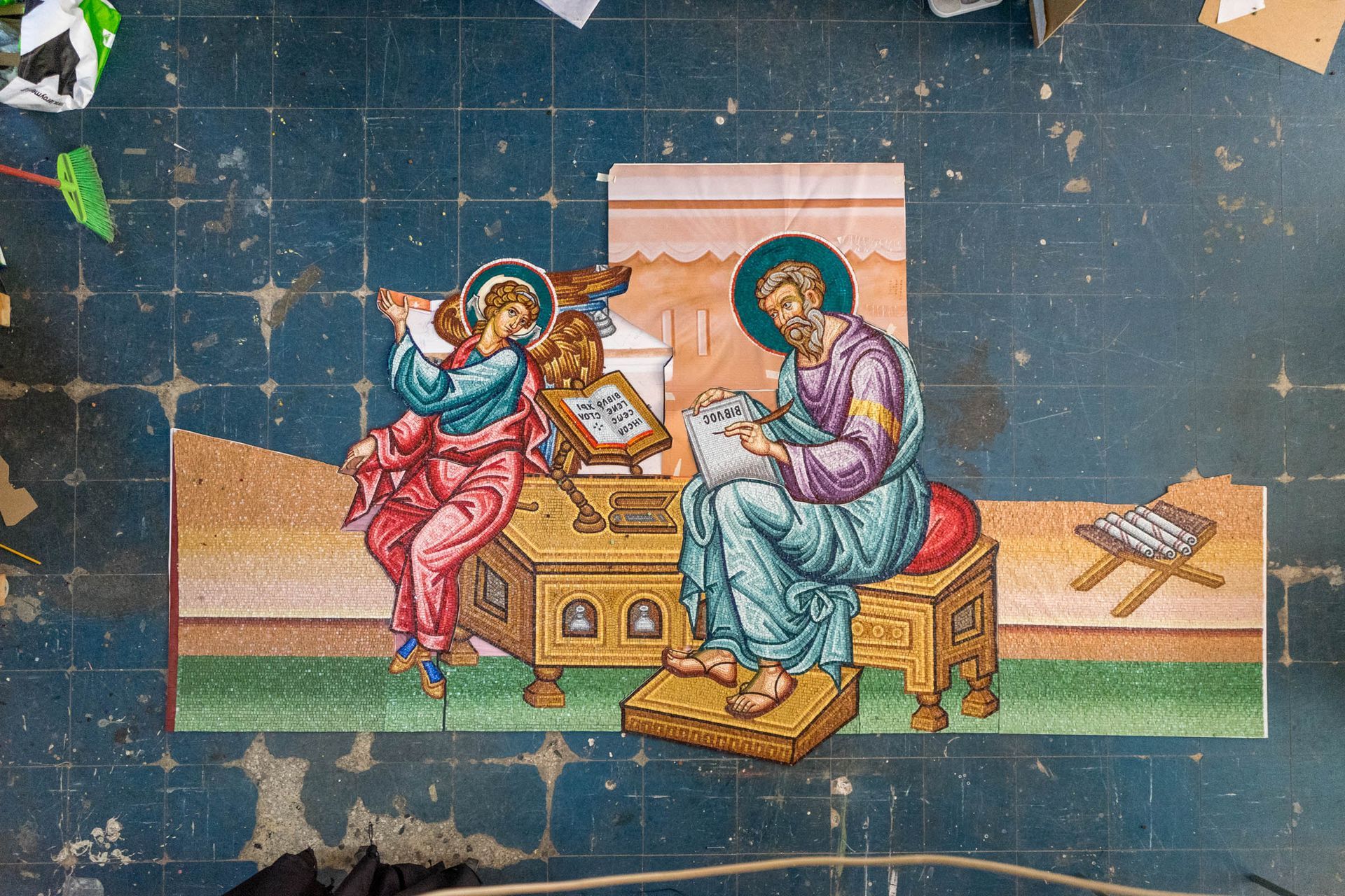 Progress photo Byzantine church mosaic panel in reverse-setting process, large St. Matthew figure for pendentive installation