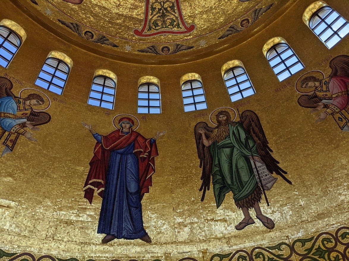 Mosaic ecclesiastical art detail of the Theotokos and Saint John the Baptist in the barrell of the dome. Denver Cathedral.