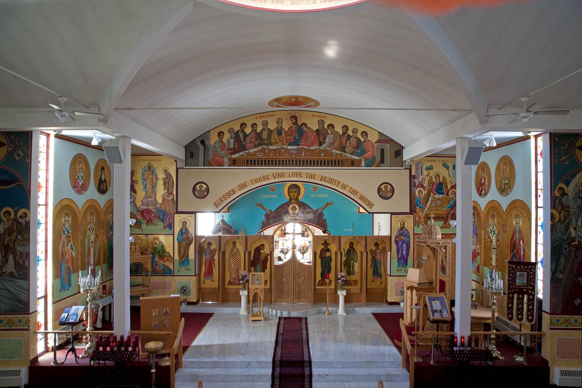 Byzantine Orthodox iconostasis with Mystical Supper fresco & full-figure saints, traditional Orthodox icons & church murals