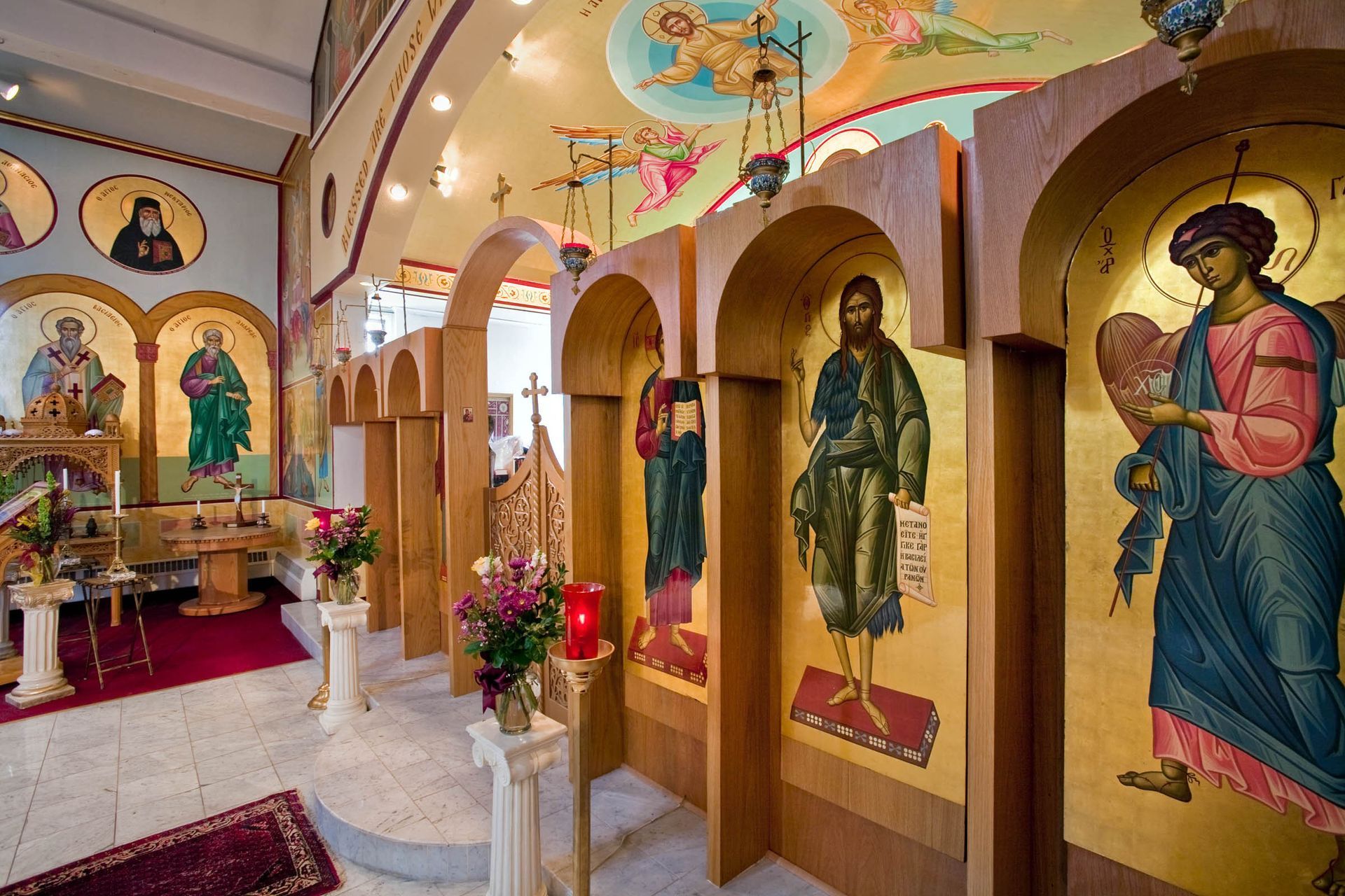 Byzantine Orthodox iconostasis with Ascension fresco & full-figure saints, traditional Orthodox iconography & church murals