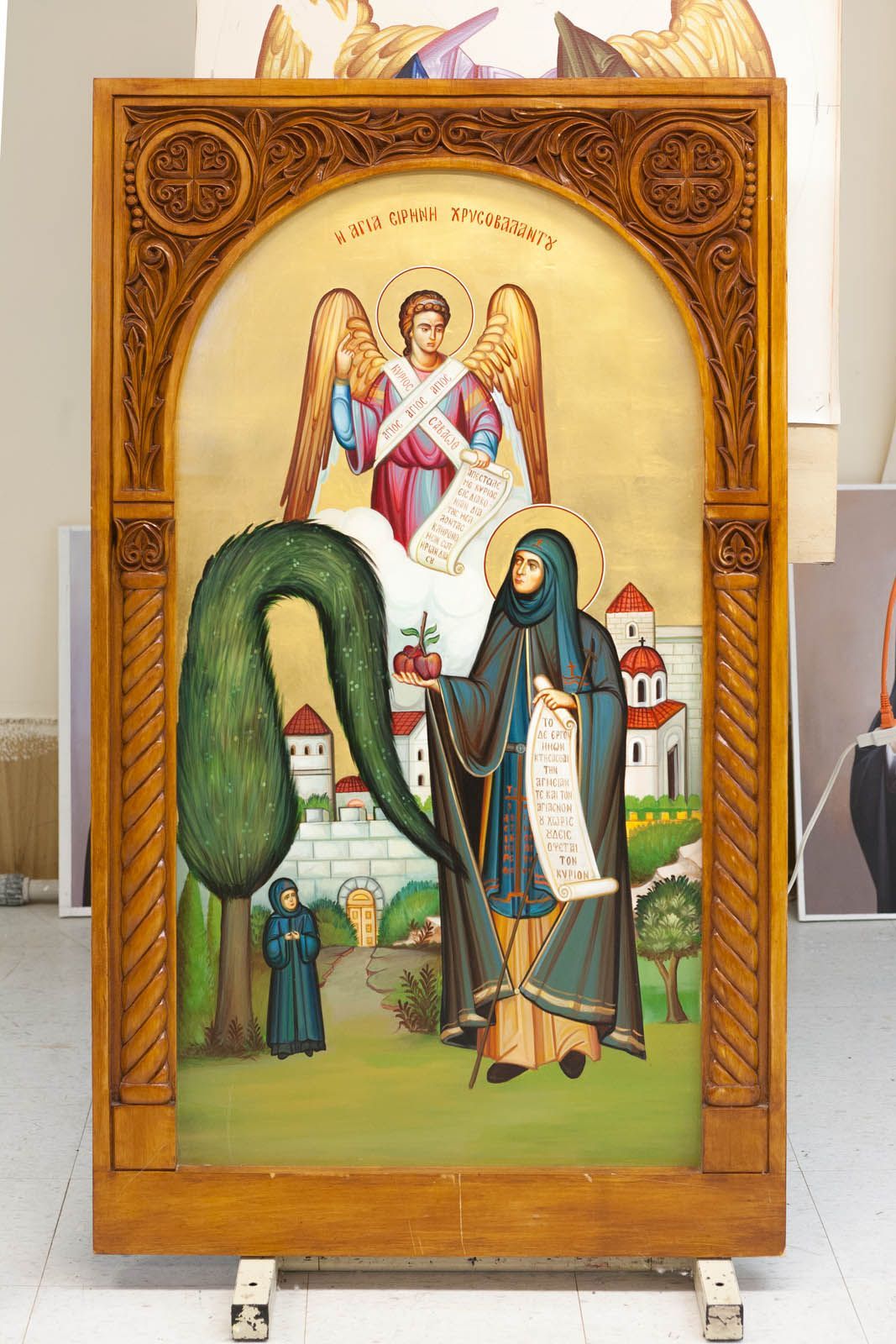 Hand-painted portable icon of St Irene Chrysovalantou with archangel, hand-carved wooden frame, Orthodox iconography