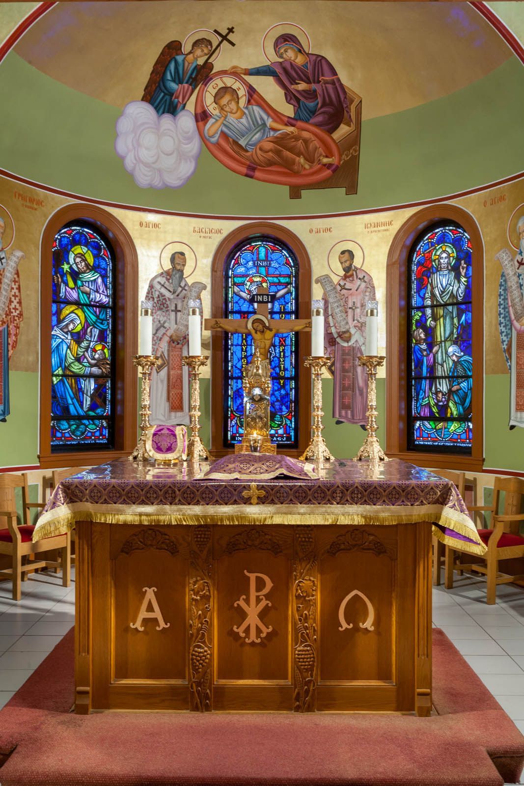 Orthodox apse iconography with the Anapeson, hierarch saints, and liturgical altar by Byzantine iconographers in Peabody, MA
