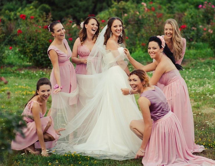 Bride and bridesmaids having fun after wedding ceremony in Washington, PA