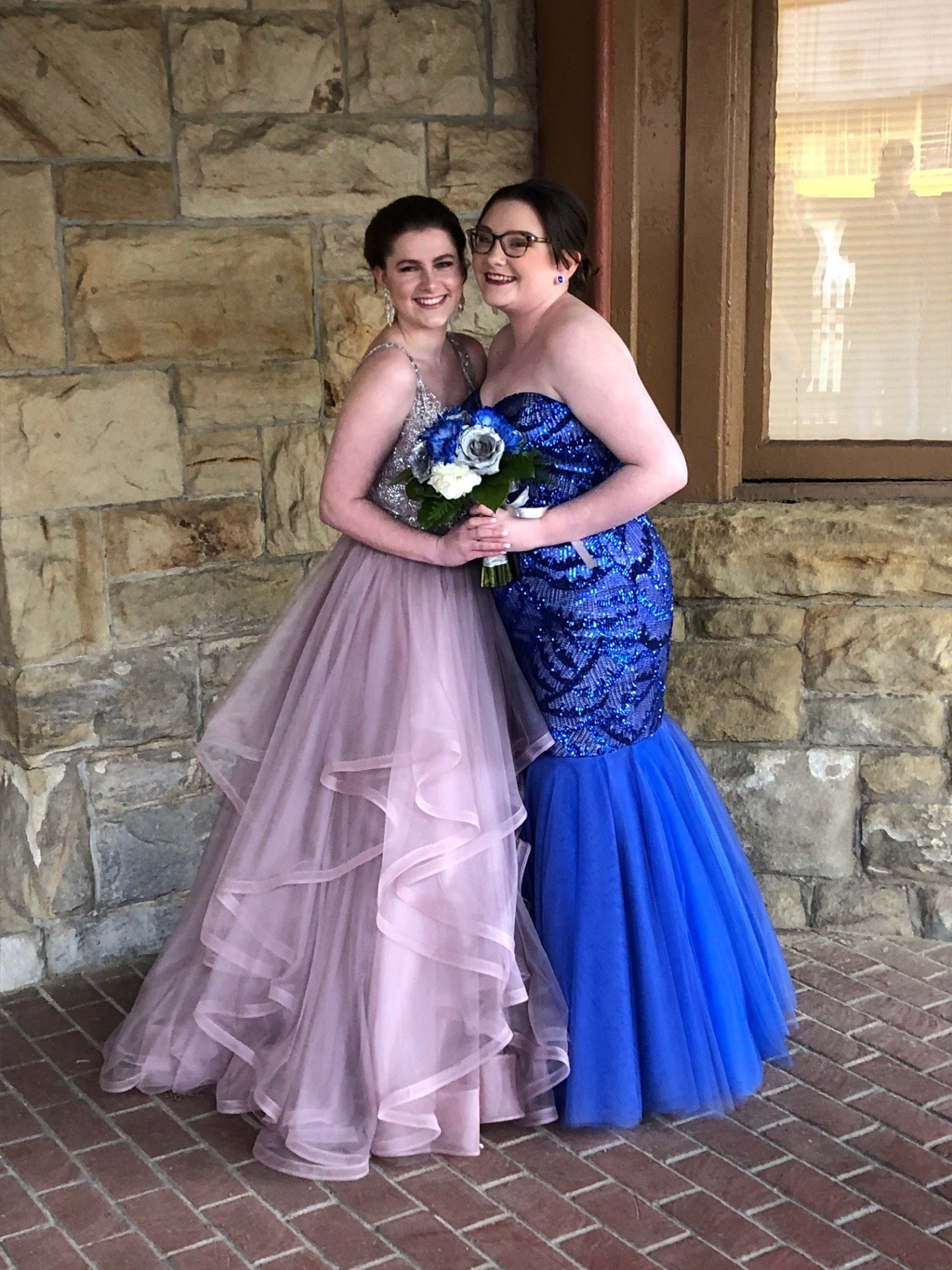 Two young beautiful girls wearing a full-length