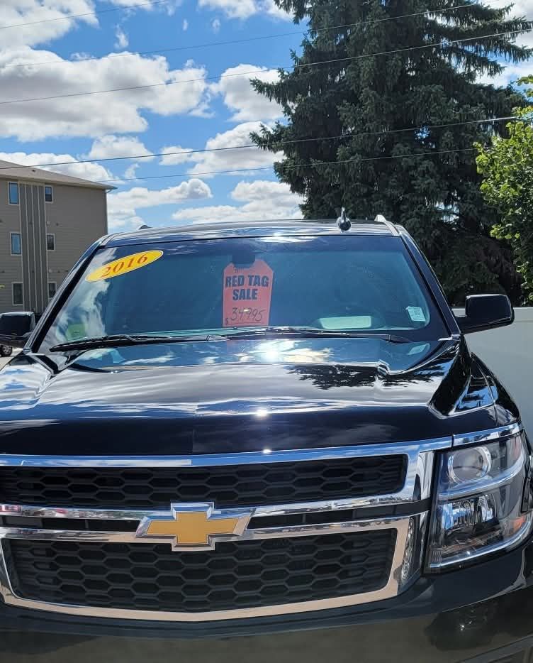 A black Chevrolet SUV parked outdoors, featuring a 