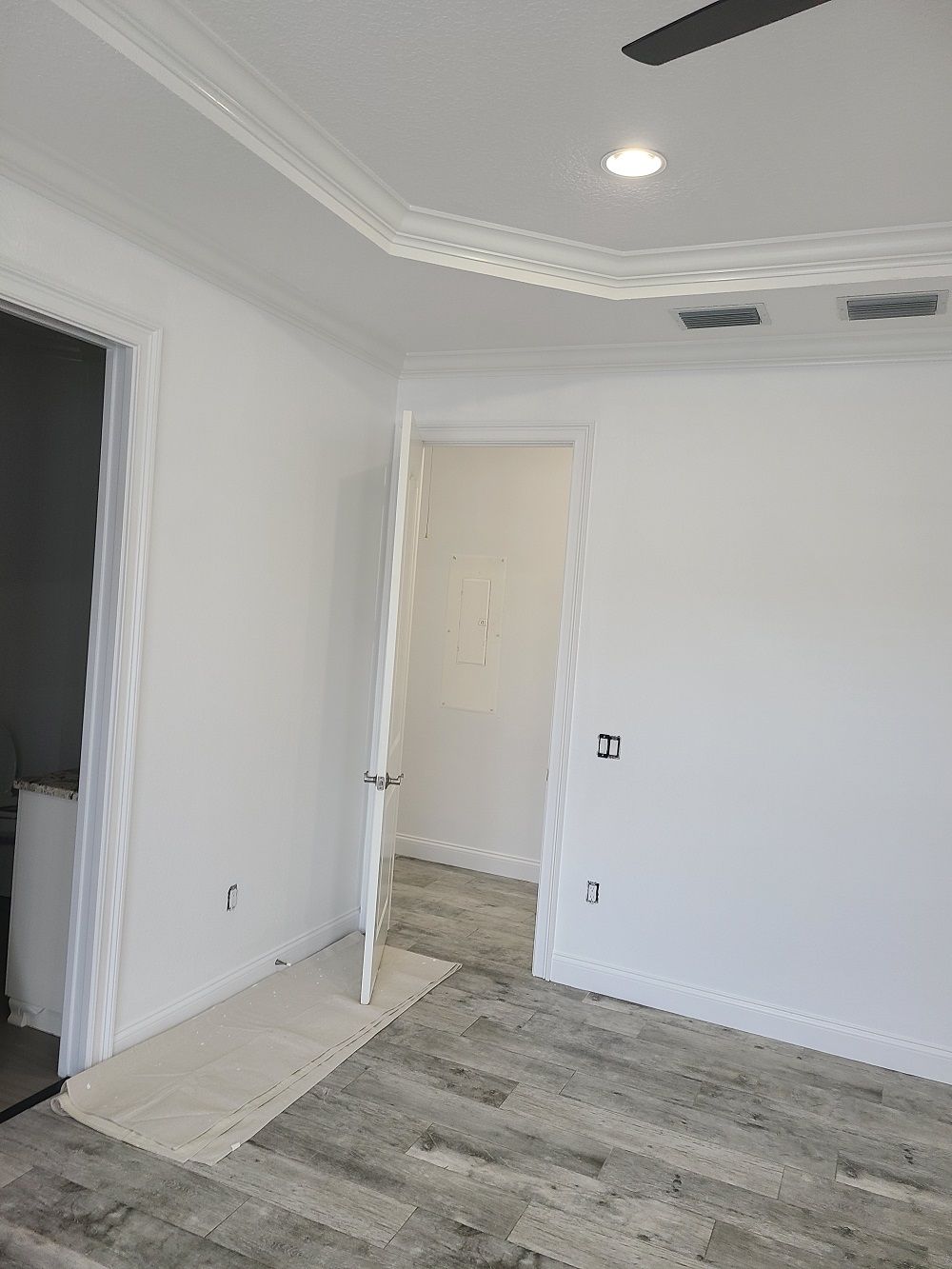 There is a ceiling fan in the room.