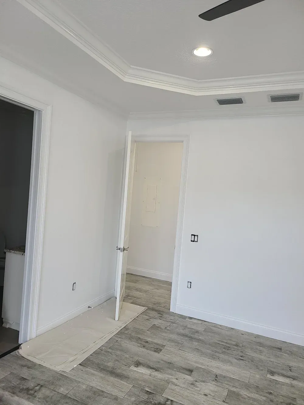 There is a ceiling fan in the room.