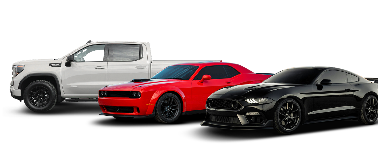 Three vehicles: white pickup truck, red Dodge Challenger, and black Ford Mustang | Don's Repair