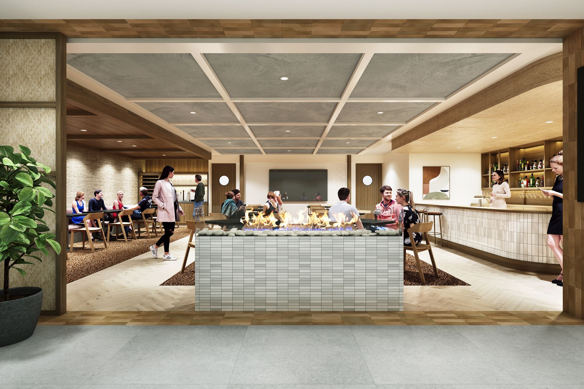 A modern dining space with a bar, serving counter, and tables. People are eating and drinking.