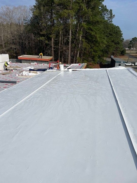 Aerial view of roof construction site.