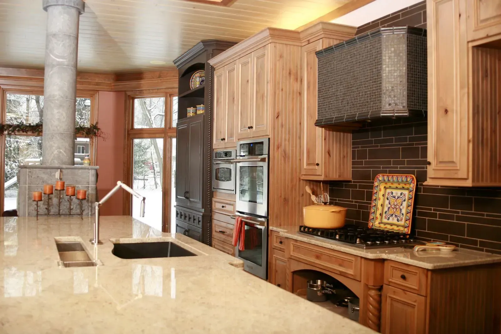 A kitchen with wooden cabinets and granite counter tops