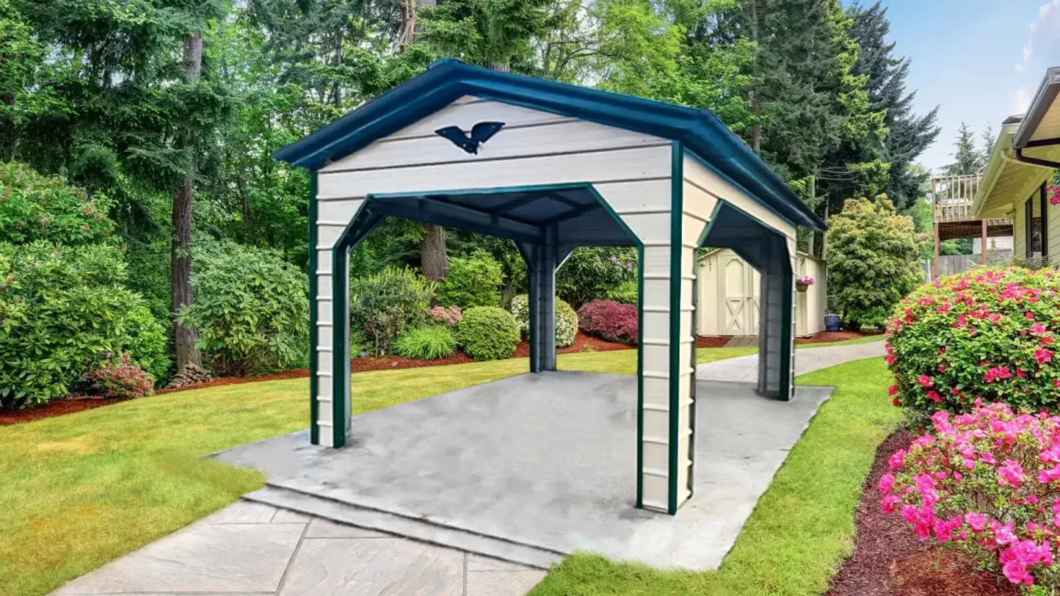 Carport with white walls, blue trim, and concrete floor in a backyard with greenery.